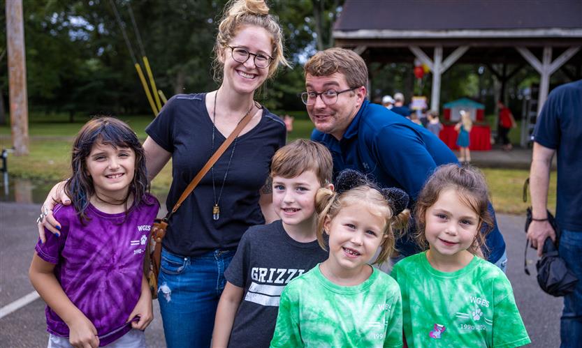A large family smiles